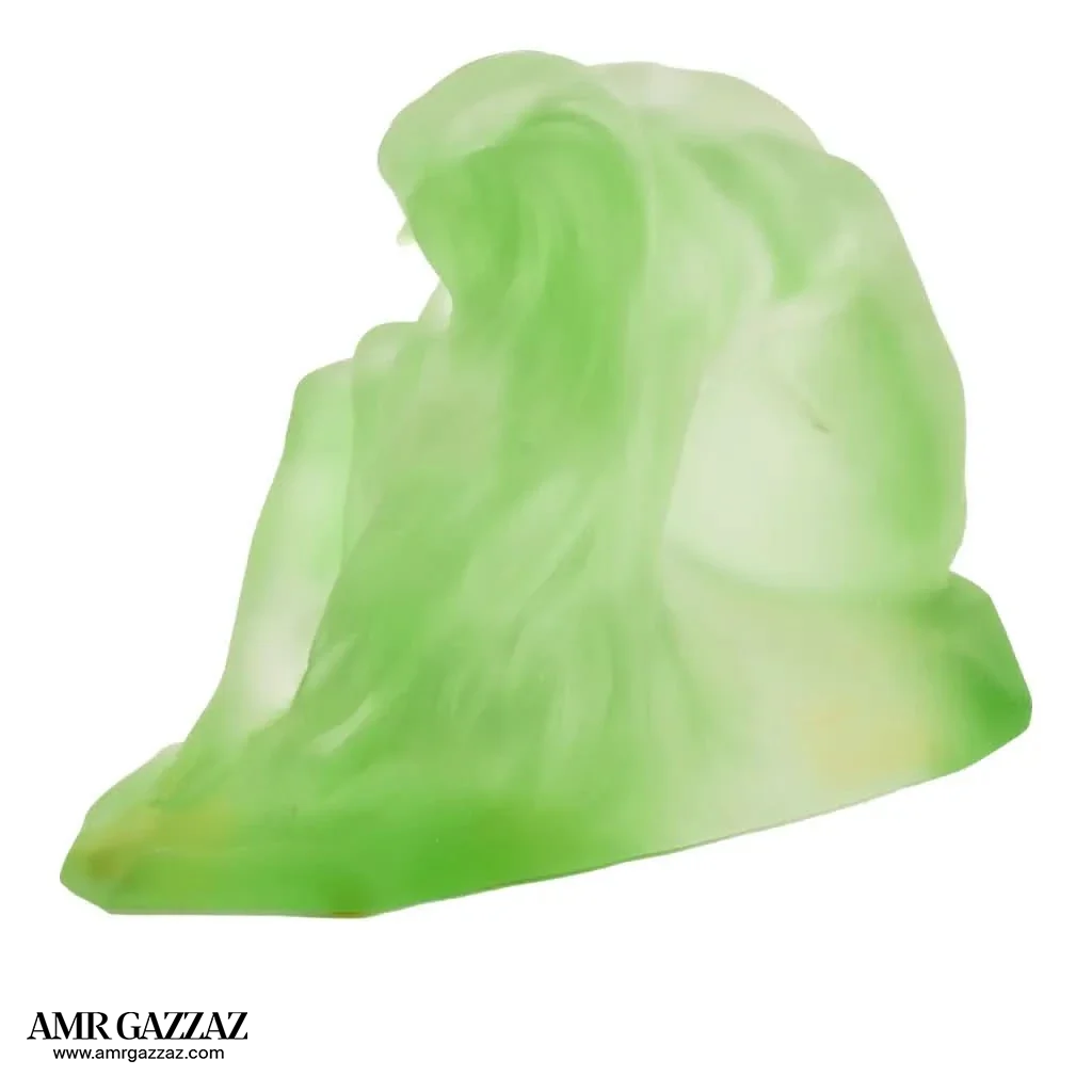A PATE-DE-VERRE FEMALE GLASS green