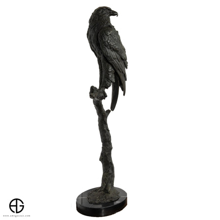Falcon bronze on tree trunk Statue