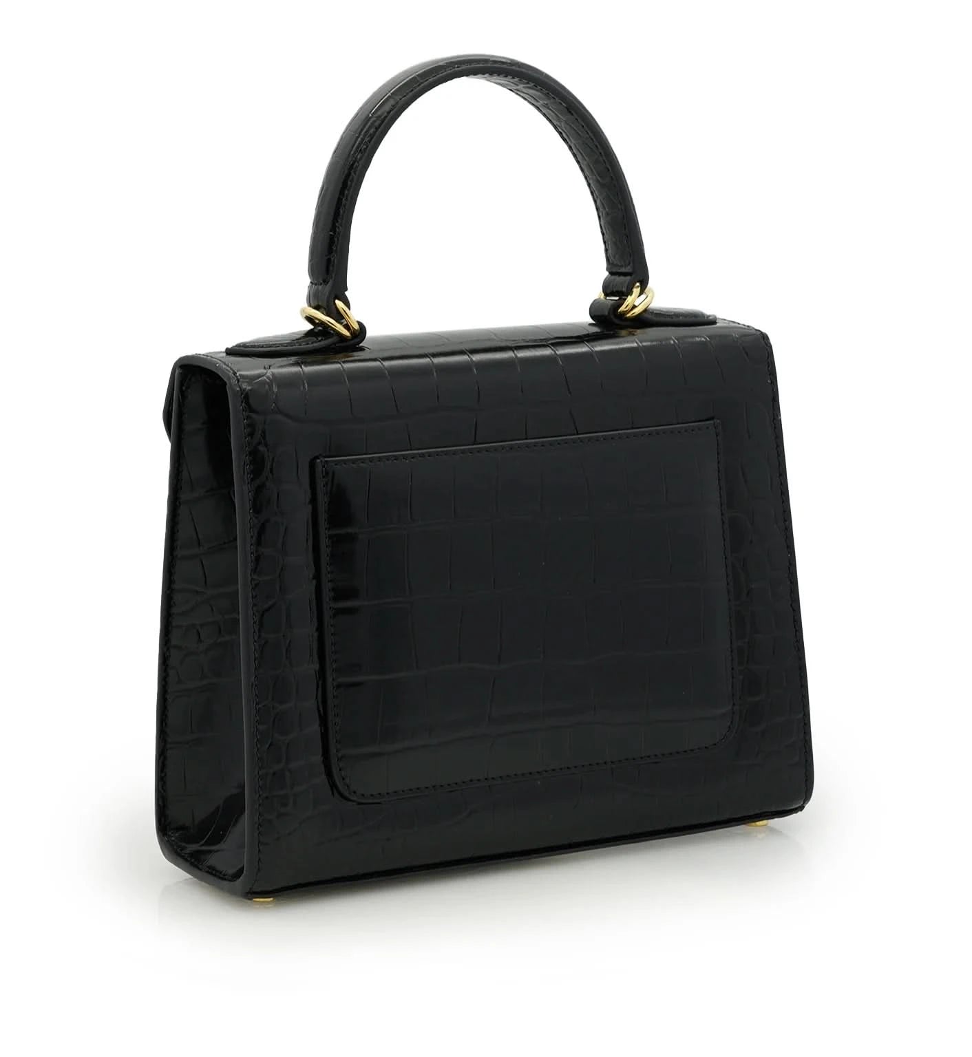 حقيبة السيدة الأولى من الجلد الأسود المنقوش بنقشة جلد التمساح