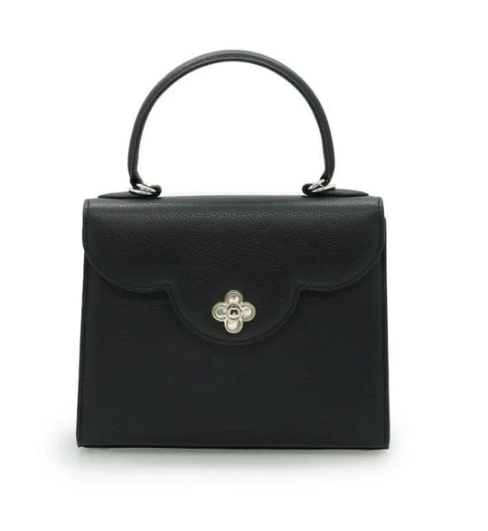 حقيبة يد جلدية سوداء مزخرفة على شكل زهرة للسيدة الأولى