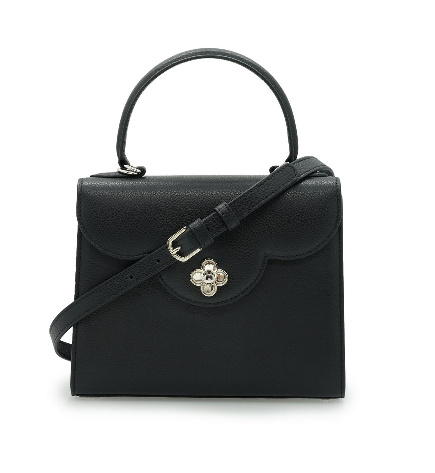 حقيبة يد جلدية سوداء مزخرفة على شكل زهرة للسيدة الأولى