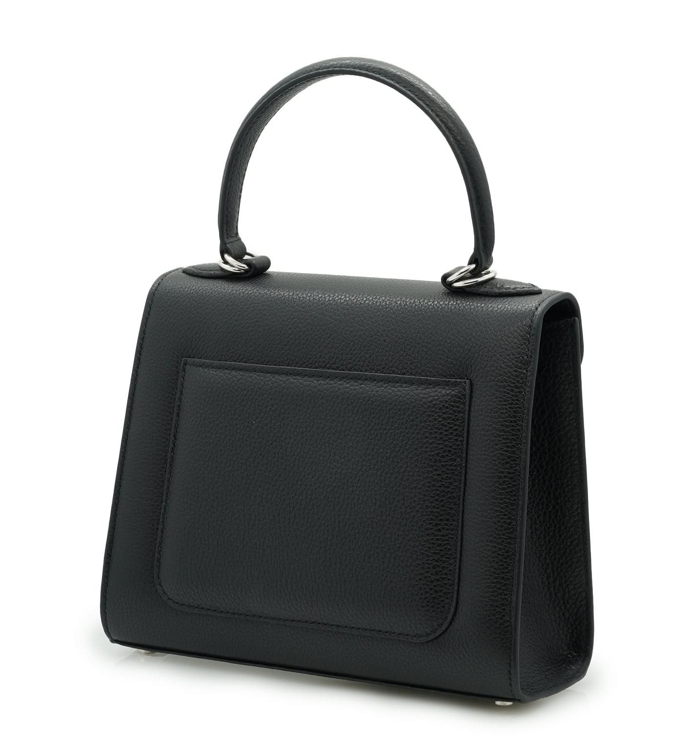 حقيبة يد جلدية سوداء مزخرفة على شكل زهرة للسيدة الأولى