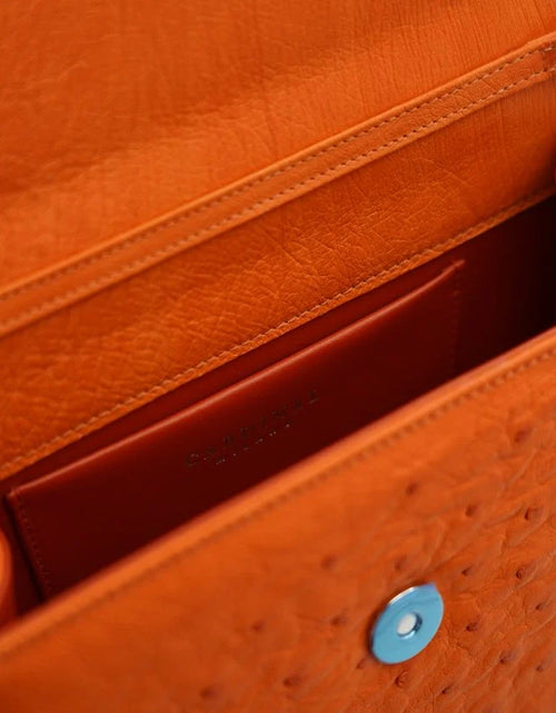Load image into Gallery viewer, Miss Cardinal Orange ostrich leather bag
